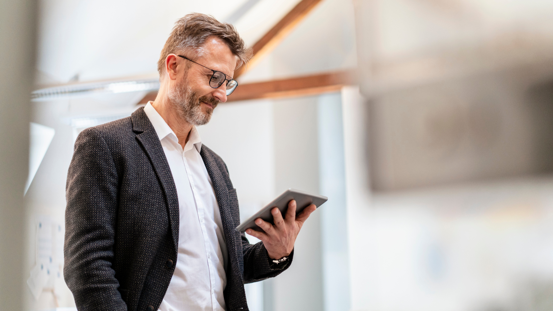 Picture of a business executive watching a bio video made by The Triangle Company